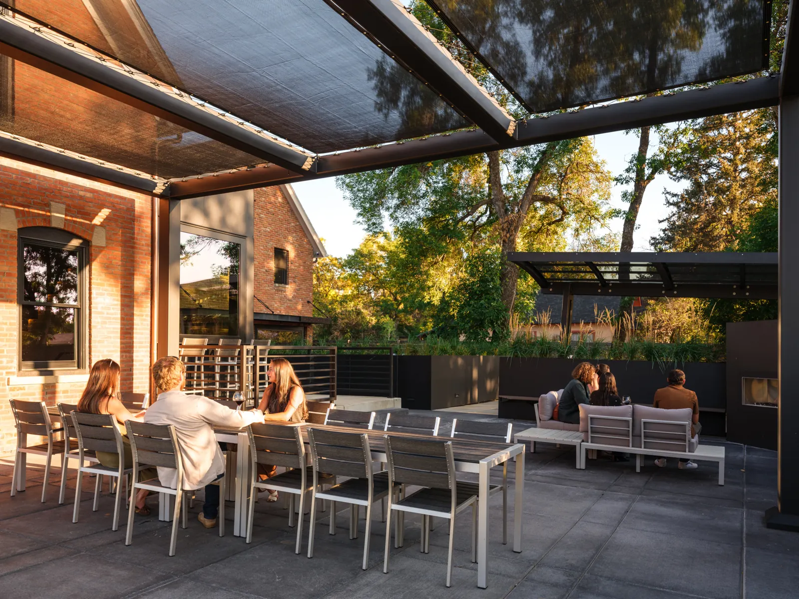 Friends enjoying the covered terrace and outdoor lounge at Vintage Estate