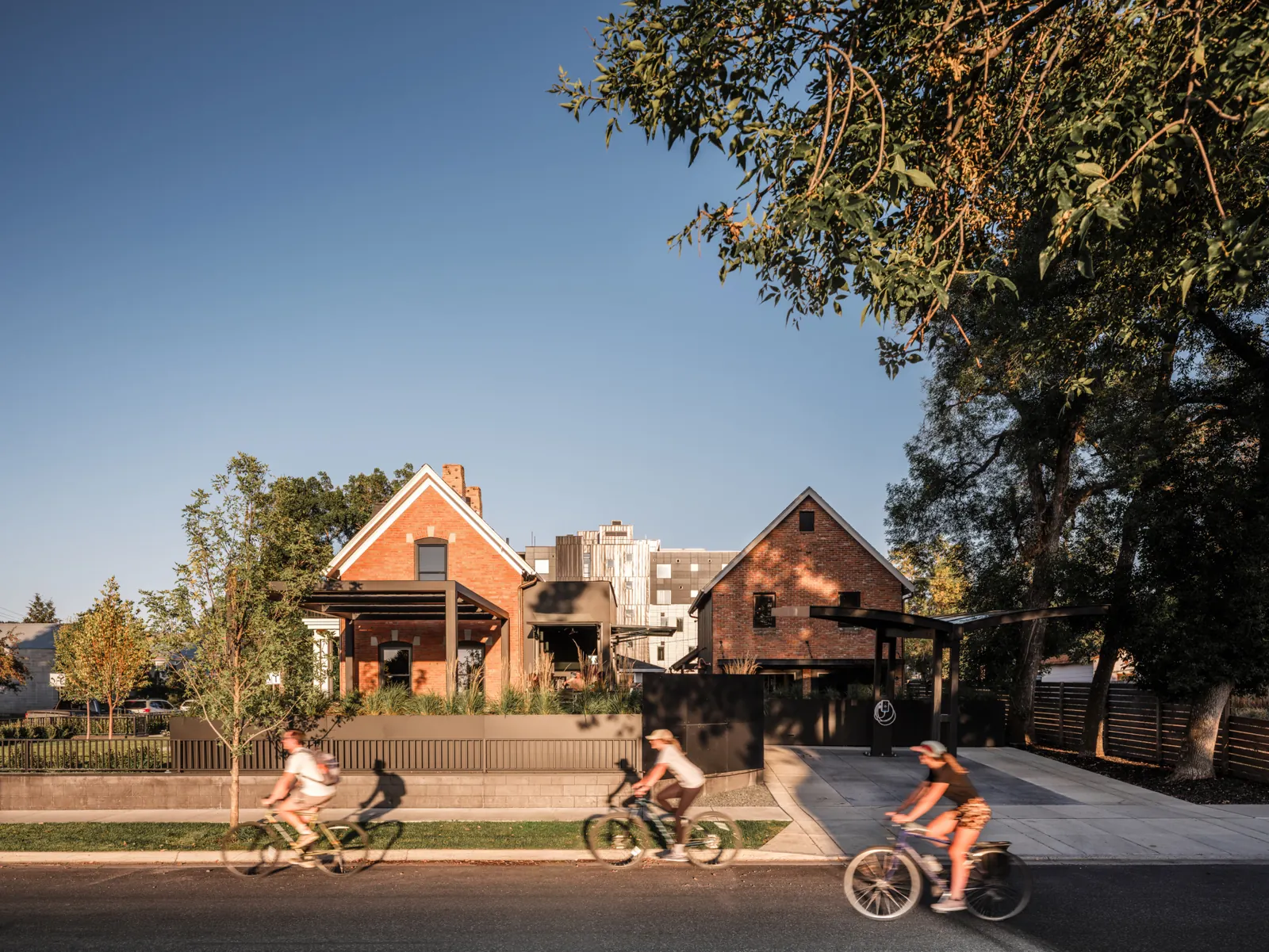 Cyclists riding past Vintage Estate in downtown Bozeman